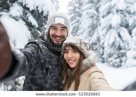 Man Taking Selfie Photo Young Romantic Couple Smile Snow Forest Outdoor Winter Pine Woods