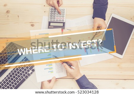 BUSINESS TEAM WORKING OFFICE WHERE TO INVEST? CONCEPT