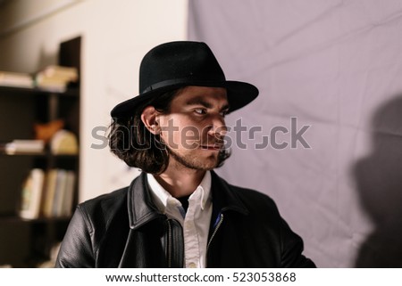 portrait of a young handsome detective. Photo closeup
