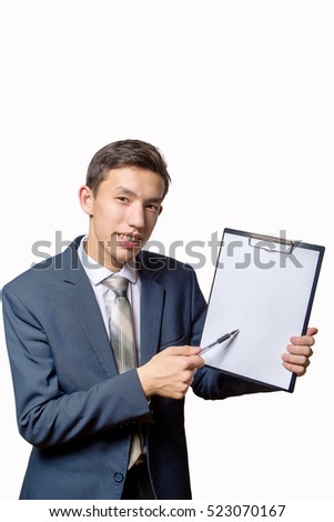 young man businessman holding clipboard and read in the office