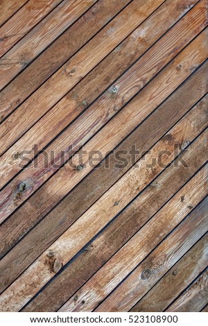 Rustic Wood Wall Vertical Texture With Tiled Wooden Decorative Planking. Vintage Exterior Or Interior Wood Slats  Shabby Background With Diagonal Boarding Or Cladding. Rural Barn Wood Brown Texture