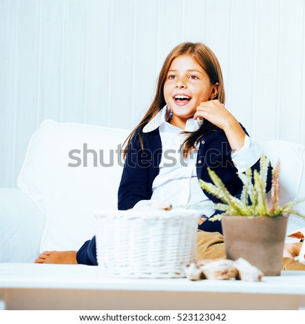 little cute brunette girl at home interior happy smiling close up, lifestyle people concept
