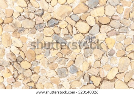 Concrete and stone gravel surface.