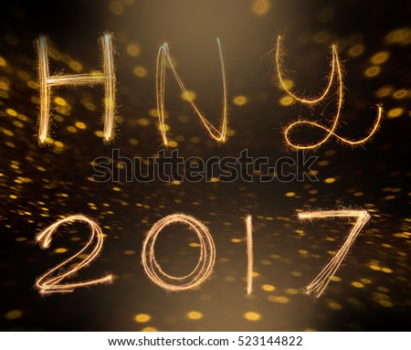 happy new years 2017 fireworks Sparkle alphabet on gold bokeh background. HAPPY NEW YEAR concept.