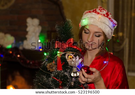 beautiful girl with a Christmas tree and lights   