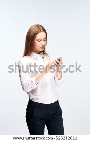 A girl clicks a telephone. A woman dials up telephone / writes a report. Exit in the internet through a mobile telephone.