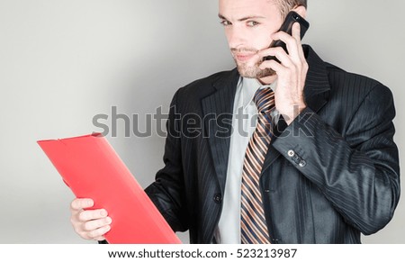 businessman with mobile and folder