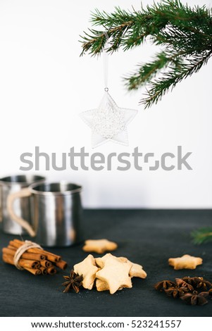 Spruce, hipster metal cups with homemade cookies on the table Christmas theme