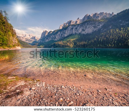 Sunny summer morning on the Gosau Lake (Vorderer Gosausee) with view of Hoher Dachstein and Gosau glacier. Colorful outdoor scene in Upper Austrian Alps, Salzkammergut region, Austria, Europe. 