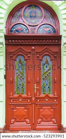 old red wooden door with metal key close-up