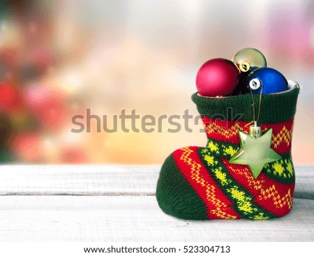 Christmas sock with xmas balls decoration background empty space for text.New year holiday greeting card.