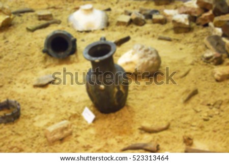 Greek ceramic amphora on sand, close up
