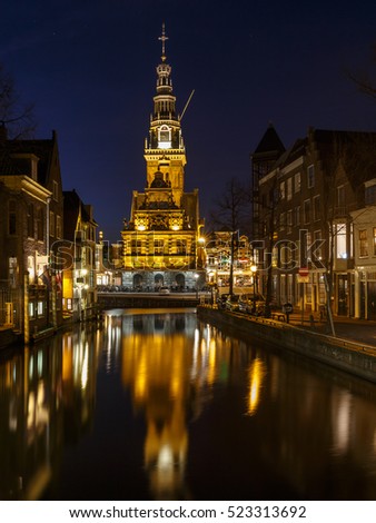 City center of Alkmaar Holland a canal and the tower of the Waag in the city of Alkmaar, The Netherlands.