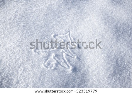 Hand christmas tree drawing on snow 