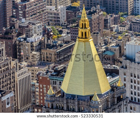 Aerial view of New York city, with close up of landmark golden pyramidal dome.