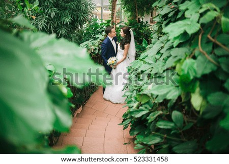 Wedding photo shoot. Beautiful groom and bride in nature
