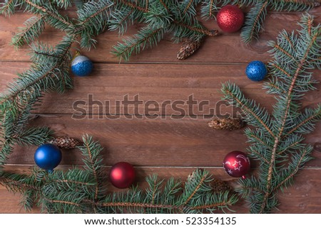 Spruce branches with Christmas balls for background. Winter wallpapers.Place for text