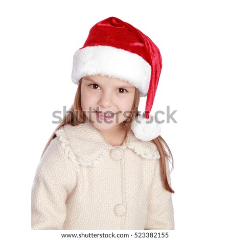 Happy little girl in santa hat