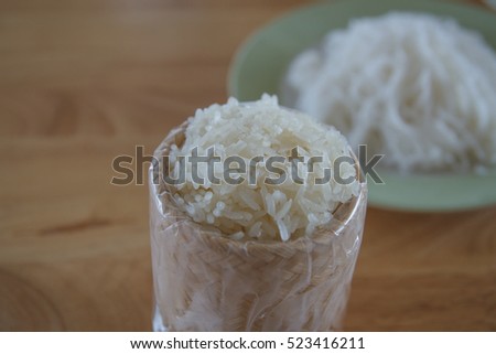 Thai vermicelli eaten with curry, Thai Food, rice vermicelli in disk  on wooden table
