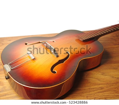 Jazz guitar on wooden table. Copy space