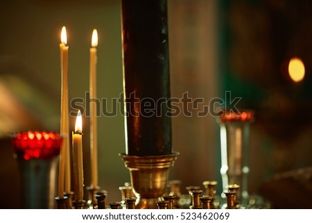 Burning candles in the church.