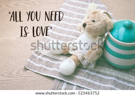 Love quote with bear and green jar picture, "All you need is love"