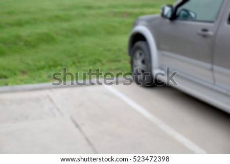 Abstract blur cars parking with bokeh light Background for use as Background