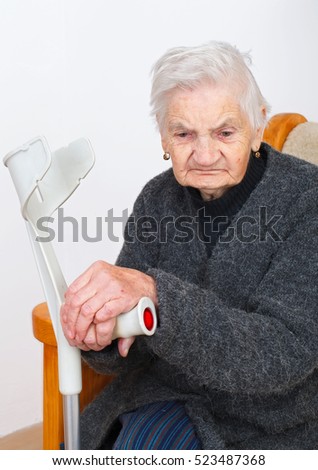 Picture of a senior woman sitting in her apartment