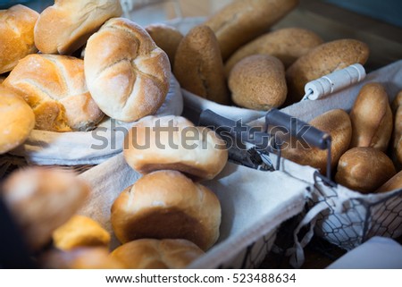 Scones, wheat buns and bread in bakery display