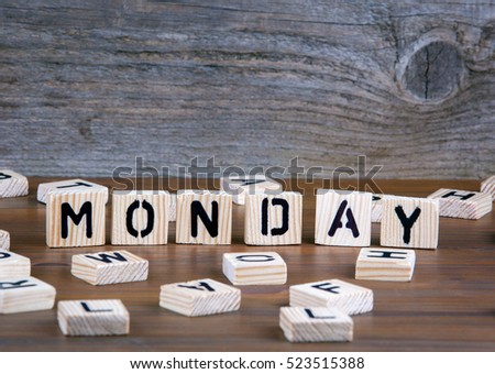 Monday from wooden letters on wooden background