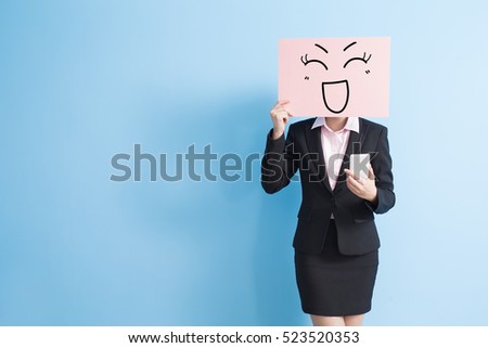 business woman take happy billboard and use smart phone, isolated blue background