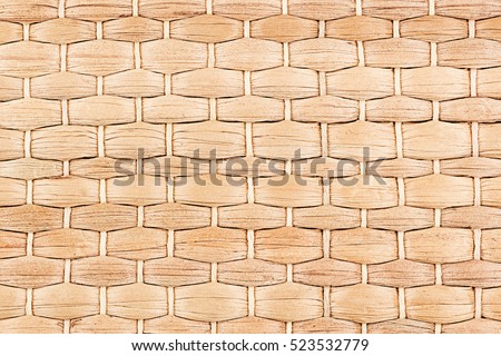 Bamboo woven beige mat handmade background. Wicker wood texture. Horisontal strips.