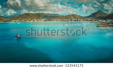 Beautiful sapphire blue water at the port of Nassau, Bahamas Royalty-Free Stock Photo #523541173