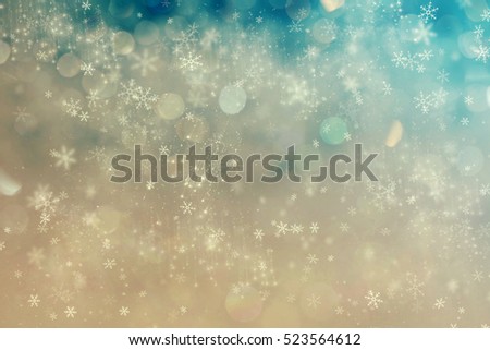 Magic holiday abstract glitter background with blinking stars and falling snowflakes. Blurred bokeh of Christmas lights.