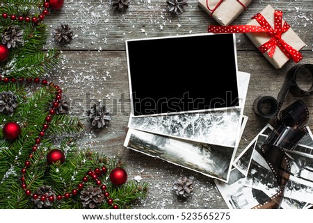 Blank christmas photo frame with gift boxes, fir tree and decor