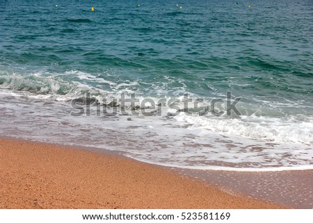 transparent beautiful waves and the sand on the seashore