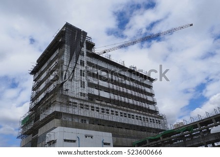 Building under construction whit cloudy sky.