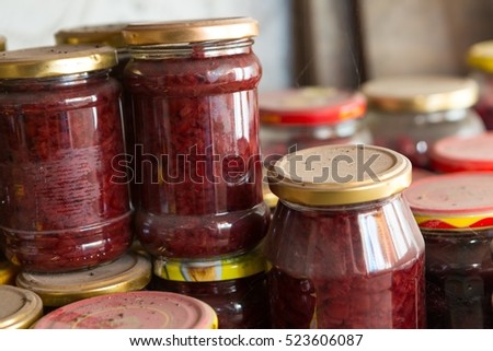 Preserves in jars in home basement. Close up of stocks kept for the winter.