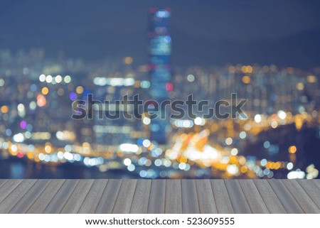 Opening wooden floor, abstract blurred lights Hong Kong city aerial view