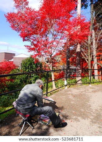 A painter with red tree, Kyoto, Japan