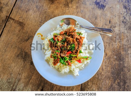 Thai food, Pad Ka Phrao, fried meat with chili, garlic and holy basil. eat with rice and fried egg, Thailand