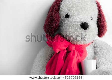 
Dog toys, dog cute Tie a pink scarf holding cup of coffee