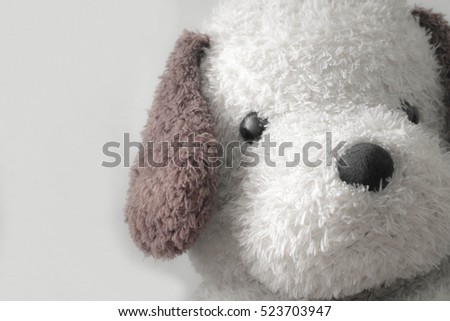 Still life vintage tone,dog doll sad and lonely