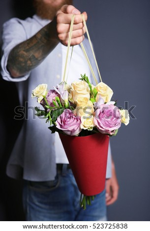 Man holding beautiful bouquet, closeup