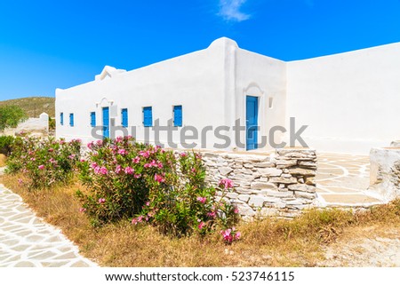 Street with traditional white Greek houses on Paros island, Greece