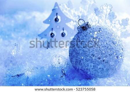 Christmas. Christmas decorations background, ball and snowflakes on a blue snowy background