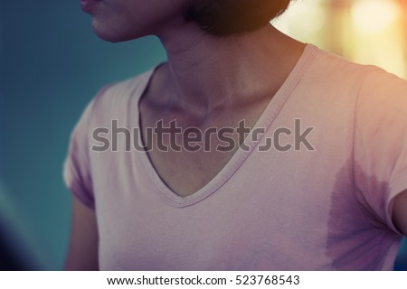 close up ; woman having sweat stain in her underarm after exercise at gym Royalty-Free Stock Photo #523768543