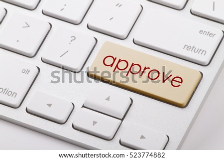 Approve word written on computer keyboard.   