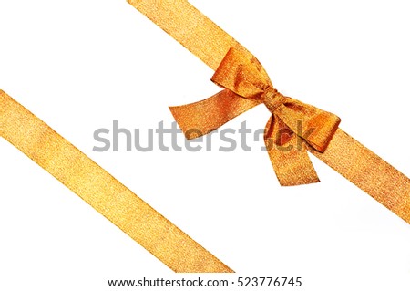 Golden sparkling holiday bow with ribbon on white background