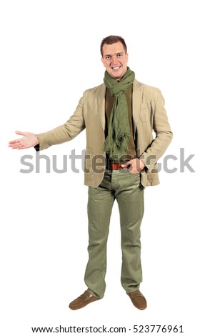 Joyful caucasian man with arm out in a welcoming gesture. Isolated on white studio background